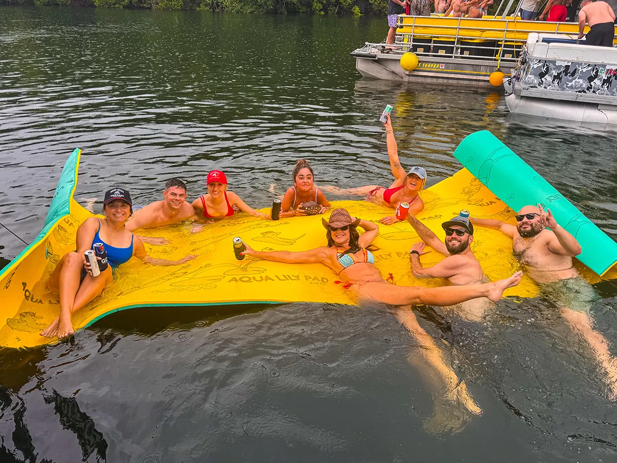 Friends celebrating a private birthday boat party on Lake Austin